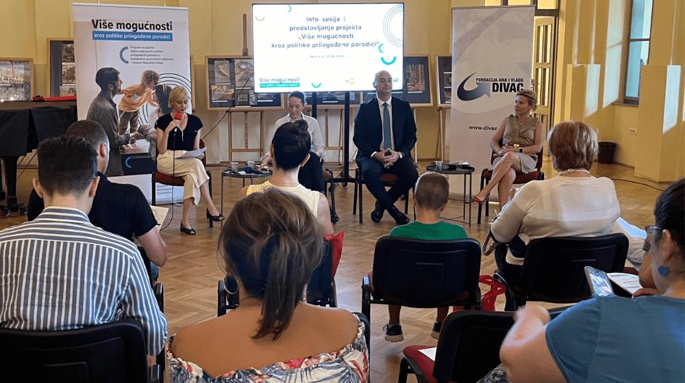 Four panelists , addressing an audience .The backdrop includes promotional UNFPA and Divac Foundation banners and a large screen